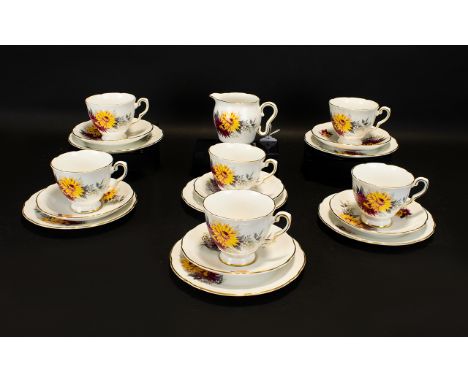 Royal Stafford Bone China Set comprising 6 cups, 6 Saucers, 6 Sandwich Plates and a Milk Jug. Floral pattern in gold and plum