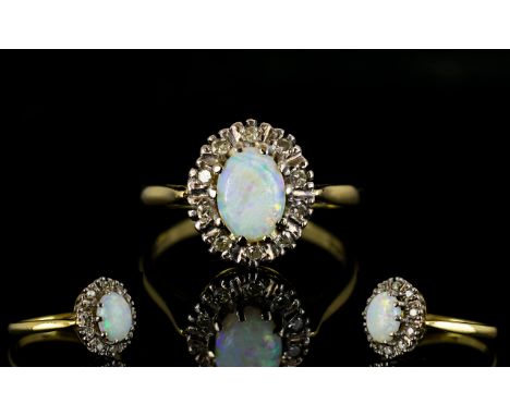 18ct Gold Attractive Opal And Diamond Set Cluster Ring Flowerhead setting with central opal cabochon, fully hallmarked for 18