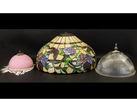A Large Tiffany Style Leaded Glass Lampshade Canopy form with fluted edge and pewter tone accents, comprising cream, blue, ru