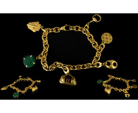 Gucci 18ct Yellow Gold Charm Bracelet Comprising six charms to include horsebit, enamel bag, Guccisima Disc, snaffle buckle, 
