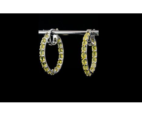 Canary Opal Hoop Earrings, large hoops set with oval cuts of the natural, ethereal yellow opal to the front and the inside ba