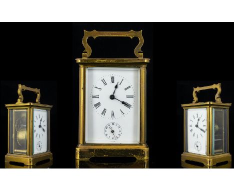 English Late 19th Century Brass Cased Carriage Clock with Alarm Facility Glass Panels, Visible Open Lever Escapement, Porcela