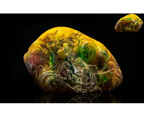 Large Carved Amber Style Oriental Boulder The front depicting scholars amongst prunus blossom, the whole in yellow, green and