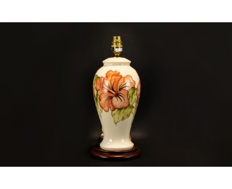 Moorcroft Hibiscus Lamp Base Baluster form lamp, cream ceramic ground with peach tubelined hibiscus flowers and green foliage
