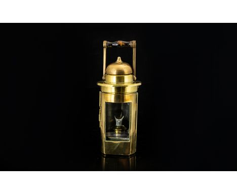 Antique Brass Lamp Of typical, cylindrical form with domed top and   hinged, glazed door to front. Minor dings to body, heigh