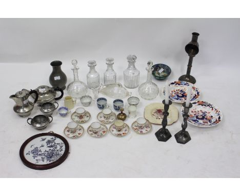 TWO PAIRS OF CUT GLASS DECANTERS, a further decanter, a hammered pewter three piece tea set, a pair of pewter candlesticks, a