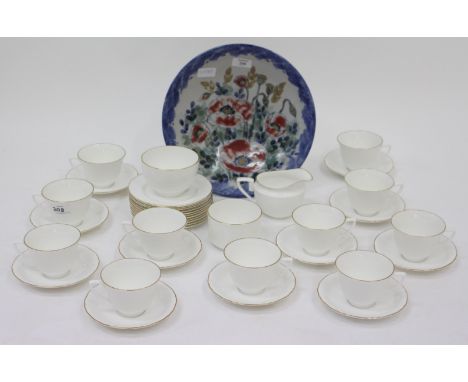 A ROYAL WORCESTER TEA SET with gilded detail to the rim and a Scottish Highland stoneware bowl decorated with poppies 