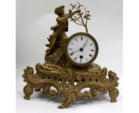 A REPRODUCTION CONTINENTAL PAINTED METAL MANTLE CLOCK with acanthus foliate scrolling, egg and dart edge, and an enamel and R