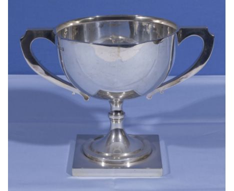 A silver cup, 16cm tall marks for Birmingham, A &amp; J Zimmerman 1918. Jackson Silversmith Southsea is marked to base, 395gm
