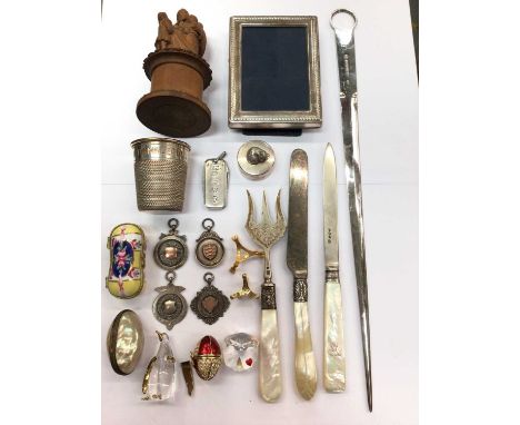 Group silver including four sports medal fobs, penknife, trinket box, silver and mother of pearl letter opener, photograph fr