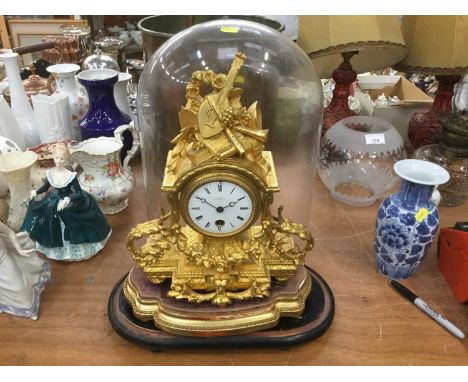 19th century French mantel clock in ornate gilded case, under glass dome,
