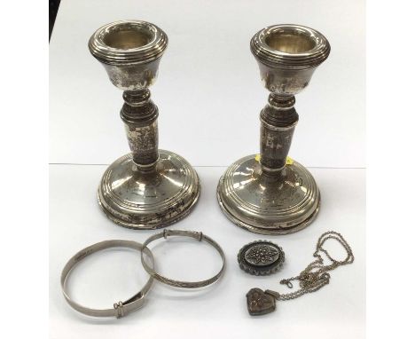 Pair of silver dwarf candlesticks, together with a group of silver jewellery to include two Christening bangles, Victorian br
