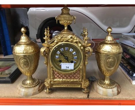 DecorativeFrench gilt metal mantle clock , key and pendulum present and pair vases and covers