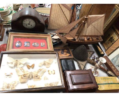 Two wooden model ships, mantle clock, various boxes, umbrellas and walking sticks, case of butterflies, embroidered seat cove