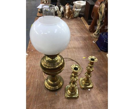 Two boxes of assorted brass ware including an oil lamp converted to electricity