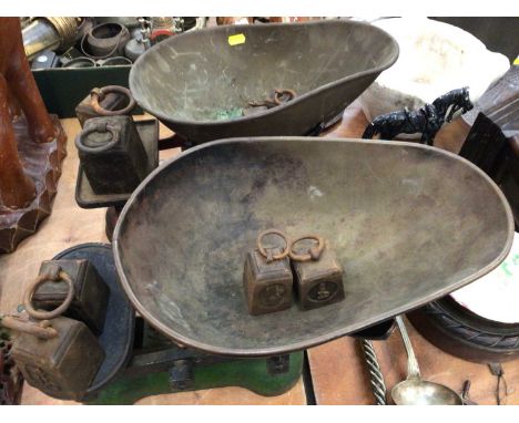 Two sets of vintage shop scales together with a carved wooden mantel clock (3)