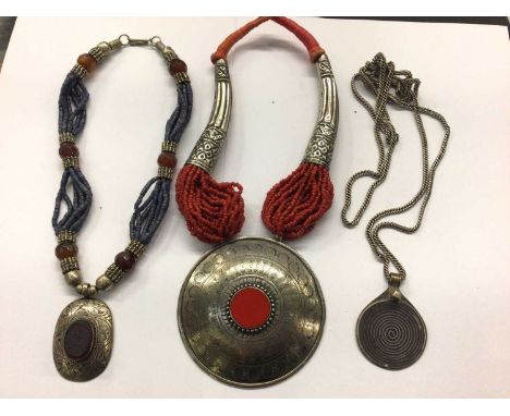 Ethnic jewellery including multi strand lapis lazuli necklace, long guard chain with niello pendant and multi strand red bead