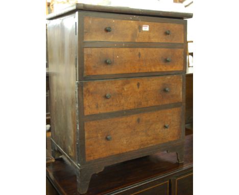 A mahogany and pollard oak double door commode cupboard, in the form of a chest