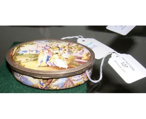 An oval enamel trinket box with figures in garden setting - 9cm 