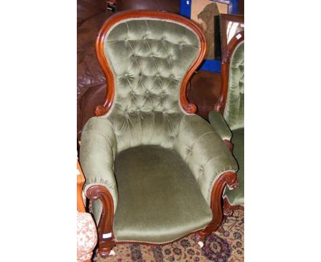 The matching Victorian scroll arm easy chair with button back 