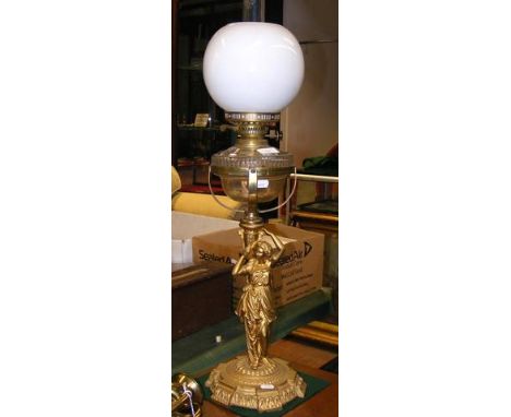 A decorative 80cm high antique oil lamp with figural column CONDITION REPORTSEEMS FINE, BEEN RE PAINTED AT SOME POINT