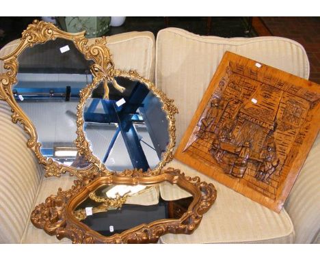 Three decorative wall mirrors, together with a carved wooden panel 