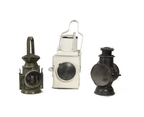 Three Railway Lamps: comprising a BR (W) tail lamp painted white, G, interior converted for mains electric lighting, a three-