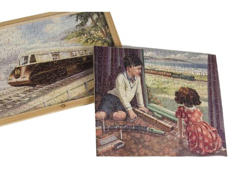 A Chad Valley GWR Jigsaw ‘The Model Railway’, showing two 1930s children playing with their 0 Gauge Train watching out of the