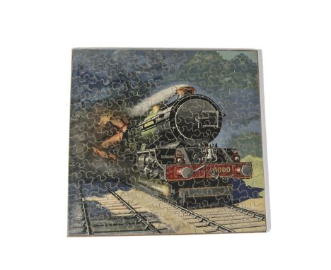 A Chad Valley GWR Jigsaw ‘Britain’s Mightiest’, showing a close up of ‘King George V’ thundering towards the viewer with a hi