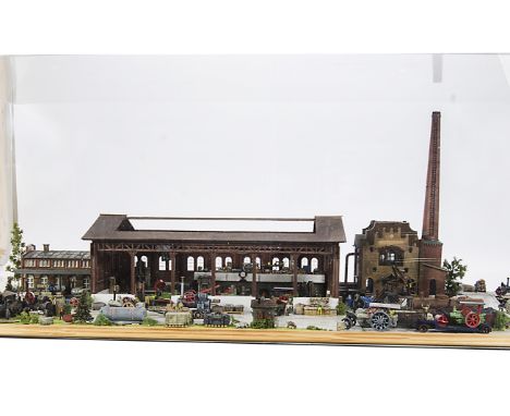 An approximately 00 scale diorama of an engine building/repair works: measuring approx 40” x 16½” x 15”, including large Cont