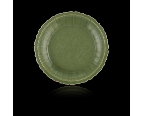  RARE AND LARGE CHINESE LONGQUAN CELADON-GLAZED 'LOQUAT' BARBED-RIM CHARGER MING DYNASTY, 14TH-15TH CENTURY 明 珍罕龍泉官窯青釉刻枇杷果紋花口