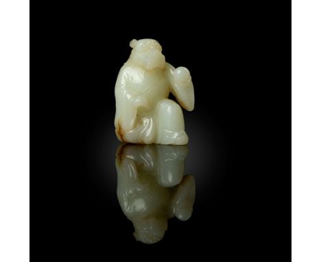  CHINESE WHITE JADE CARVING OF A DRAGON-HEADED DEITY QING DYNASTY 清 白玉雕龍官持珠擺件carved in round with the dragon-headed deity in 
