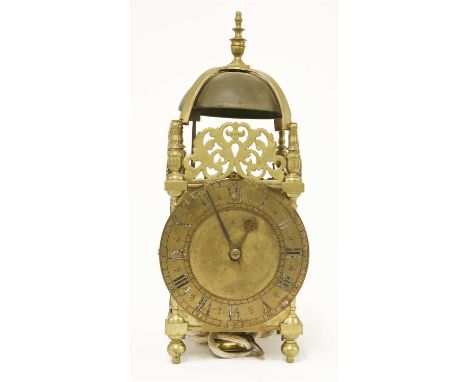 A hook and spike brass lantern clock, 17th century and later, the bell on fret cut brass mounts, with weight and pendulum, 40