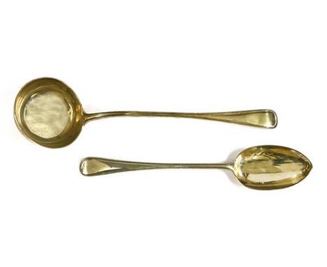A silver punch ladle and a basting spoon, by Robert Stebbings &amp; George Adams, London, 1903 and 1867, in the old English b