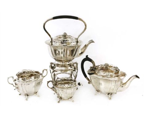 A four-piece silver tea set, George Wish and Co. Ltd., Sheffield 1912, comprising: a kettle on stand, teapot, cream jug and s