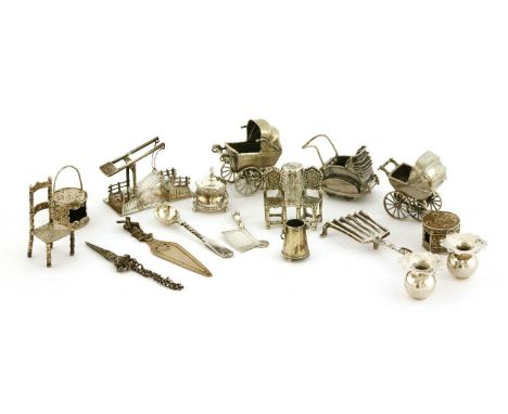 A collection of silver miniatures, comprising: three bassinet prams, three chairs, a drawbridge, a griddle, a pair of spittoo