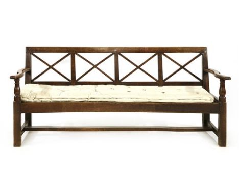 An elm and oak hall bench, with a 'X' latticed back, with straw stuffed ticking seat, later sprung , 180cm long seat 39cm hig