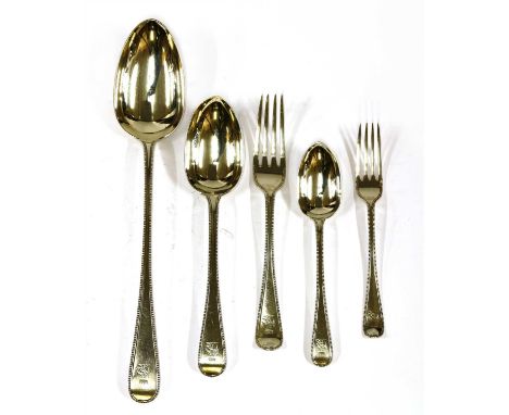 A part canteen of Victorian bead pattern silver flatware, Chawner &amp; Co., London, 1867, consisting of: a basting spoon, 6 