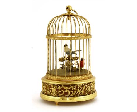 A Reuge musical birdcage automaton, mid-20th century, the domed cage with two singing birds inside on a pierced leaf and bird