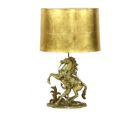 A brass table lamp in the form of a Marly horse, 20th century, complete with gold paper shade, 74cm high