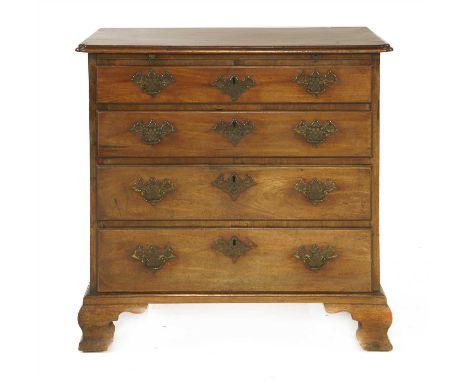 A mahogany chest of drawers, 18th century, the top with re-entrant corners over a brushing slide, four graduated long drawers