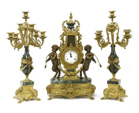 A Louis XV-style clock garniture, of lyre form with satyr supports flanked by seven-light candelabra, the movement marked Fra