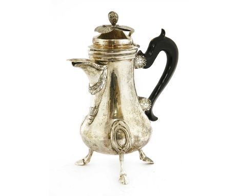 A silver hot water pot, 18th century, probably Maltese with three indistinct marks to the base, the hinged domed cover with a