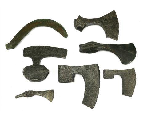 Antiquities, five medieval iron axe heads, a bronze axe head and a bronze sickle blade (7)