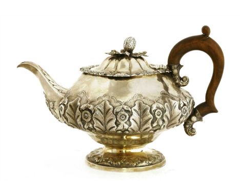 A William IV silver teapot, Jonathan Hayne, London, 1833, with cast decoration and melon knop, 19cm high, 23ozt approximately