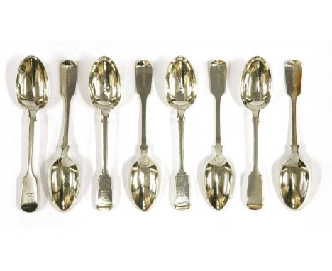 A set of twenty-four Victorian silver fiddle pattern dessert spoons, by George Adams, London 1888, one spoon 1877, each engra