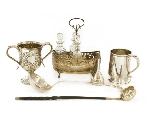 A collection of silverwares, comprising: a two-handled cup, marks rubbed, a Georgian oval cruet stand, 25cm high, a soup ladl