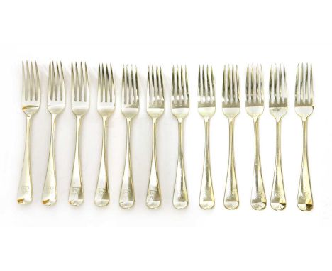 A set of twelve Victorian silver old English pattern table forks , by George Adams, London, 1871, each engraved with the cres