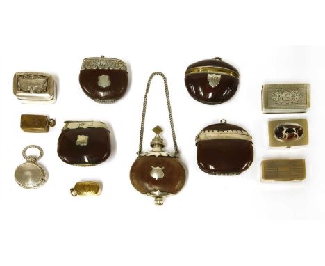 Four nut vesta cases, one by 'LE', one inscribed 'A Christie' and stamped 'sterling', together with a nut scent flask, and se