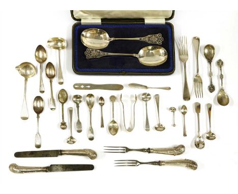 A collection of silver flatware, including: 11 dessert forks, London 1890, and eight pairs of Georgian pistol grip knives and